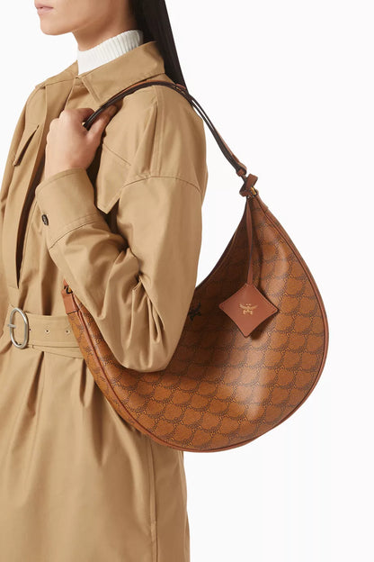 MCM Himmel Ascending Moon Hobo Bag in Lauretos Monogram Canvas Brown
